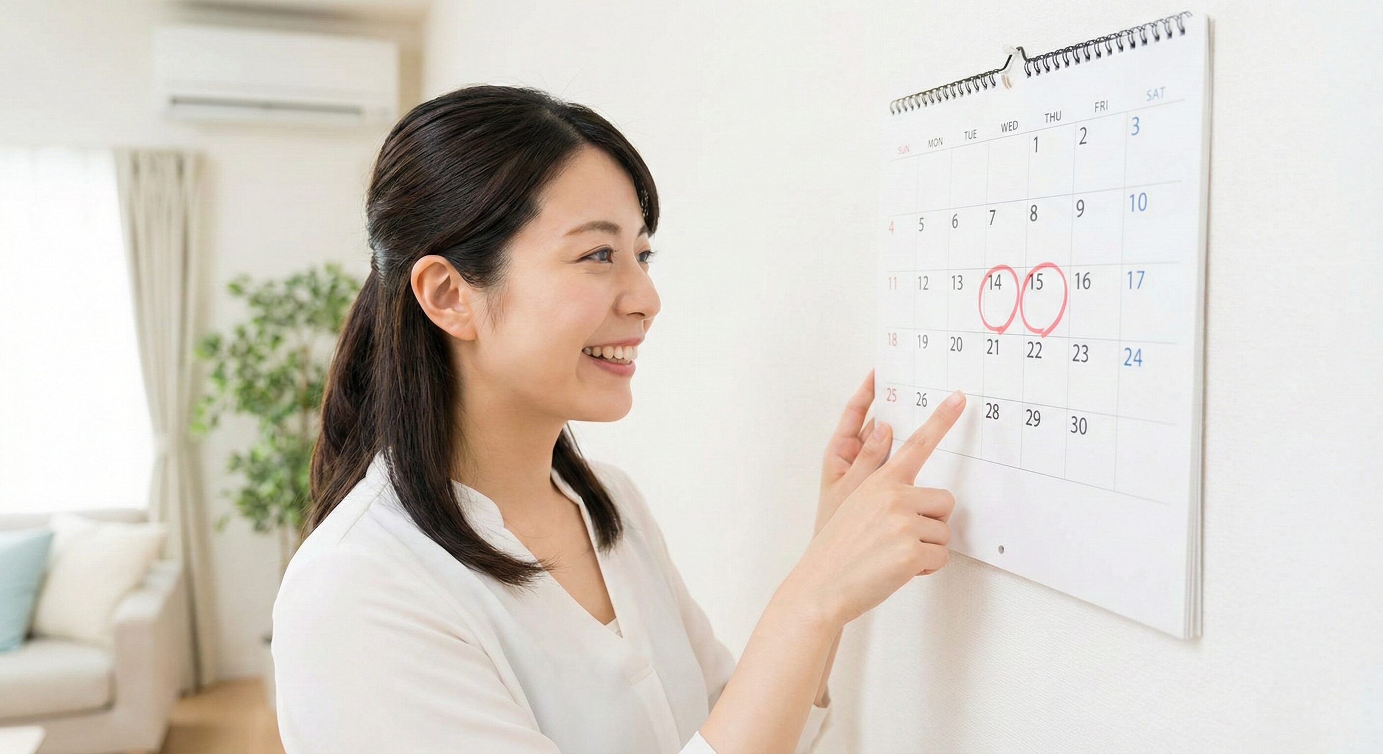 カレンダーに週2回の印をつけて喜ぶ会社員